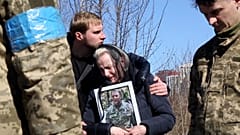 Grieving wife and son mourn the death of Yuriy Shabadash