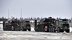 British troops and military equipment upon their arrival at Estonia's NATO Battle Group base in Tapa, Estonia, Friday, Feb. 25, 2022. 