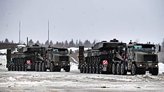 British troops and military equipment upon their arrival at Estonia's NATO Battle Group base in Tapa, Estonia, Friday, Feb. 25, 2022. 