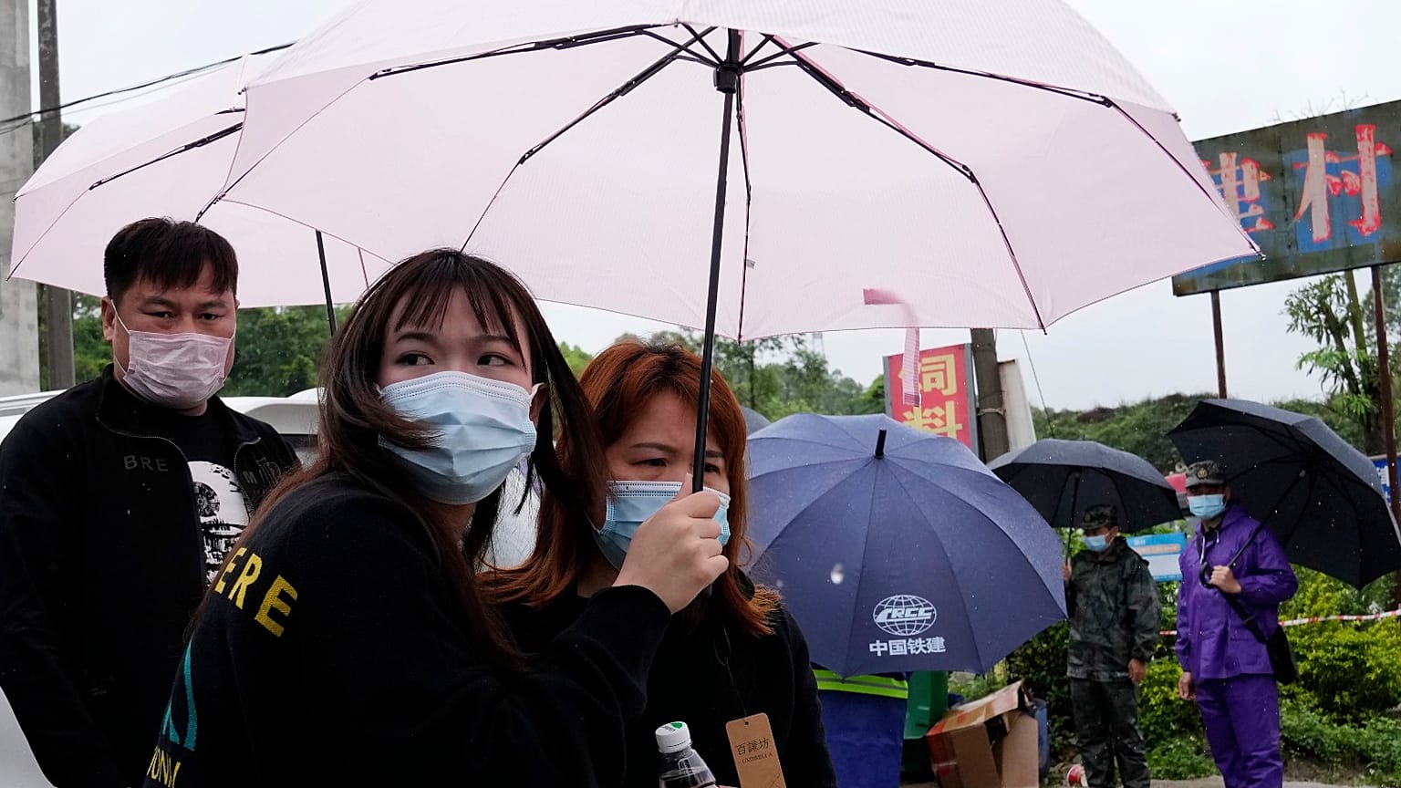 Relatives of passengers onboard the China Eastern Flight 5735 leave the village near the crash site on Wednesday, March 23, 2022, in southwestern China's Guangxi province.