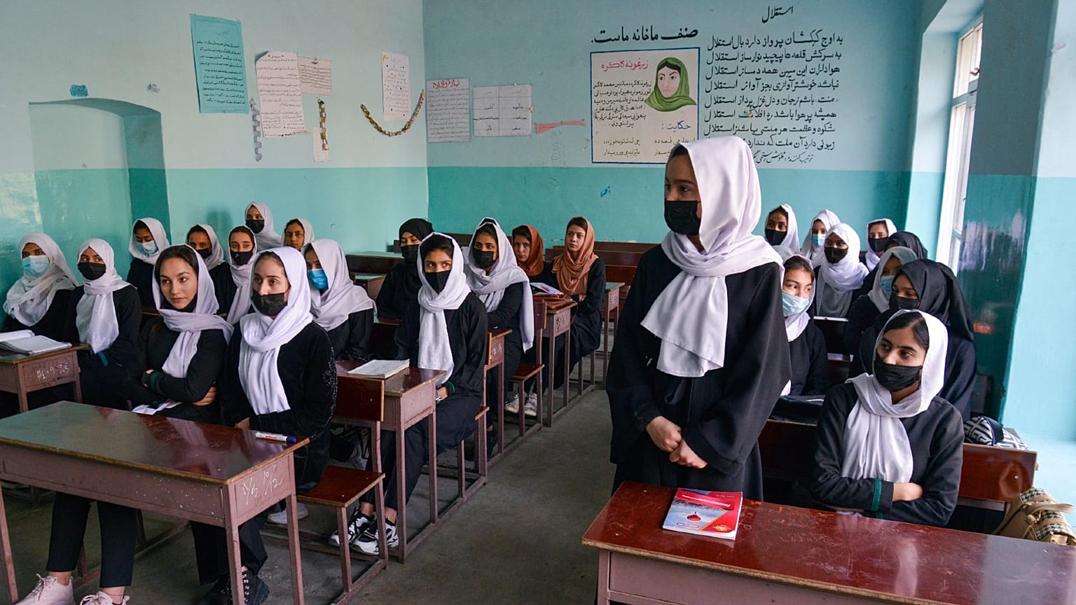 Girls attend class in Kabul on Wednesday shortly before the Taliban ordered some schools to close. 