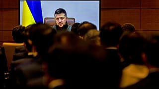 Members of Japan's lower house of parliament applaud as Ukrainian President Volodymyr Zelenskyy 
