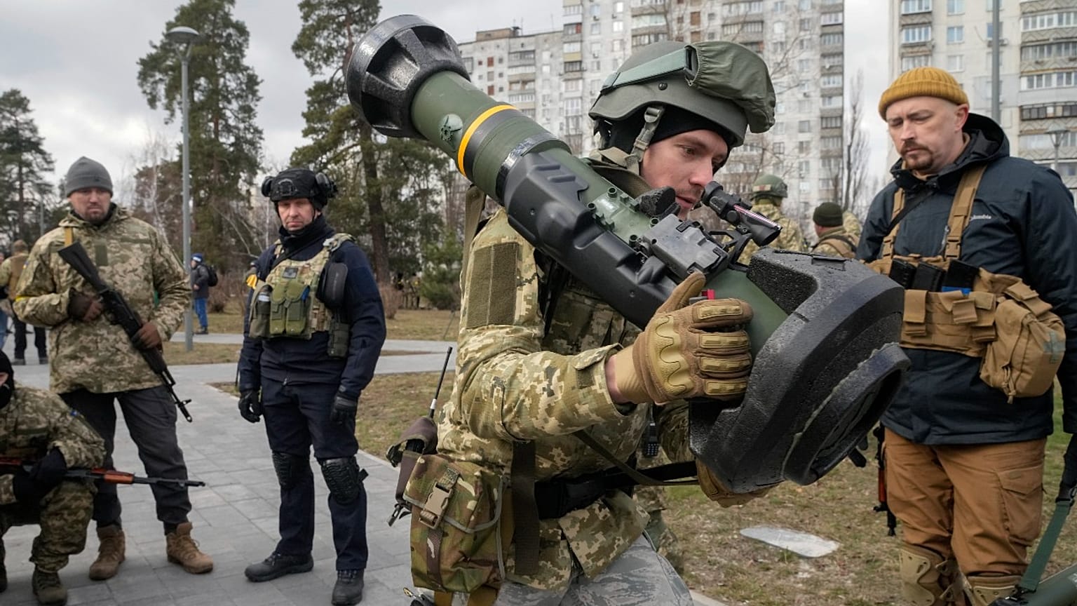 A Ukrainian Territorial Defence Forces member holds an NLAW anti-tank weapon, in the outskirts of Kyiv, Ukraine