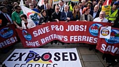 People take part in a union protest in solidarity with 800 P&O Ferries workers fired last week, opposite the Houses of Parliament, in London, Monday, March 21, 2022. 