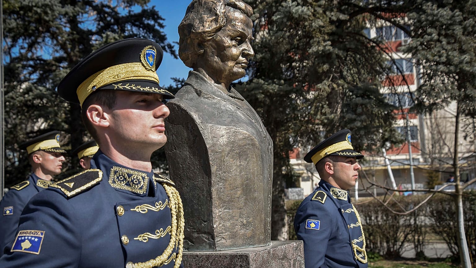 Kosovo Army honor guards stand guard next to a statue of former U.S. Secretary of State Madeleine Albright, in Pristina, Kosovo, Thursday, March 24, 2022. 