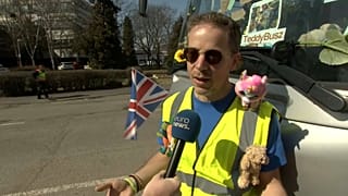 A volunteer from England who travelled to Hungary to distribute teddy bears to children. 
