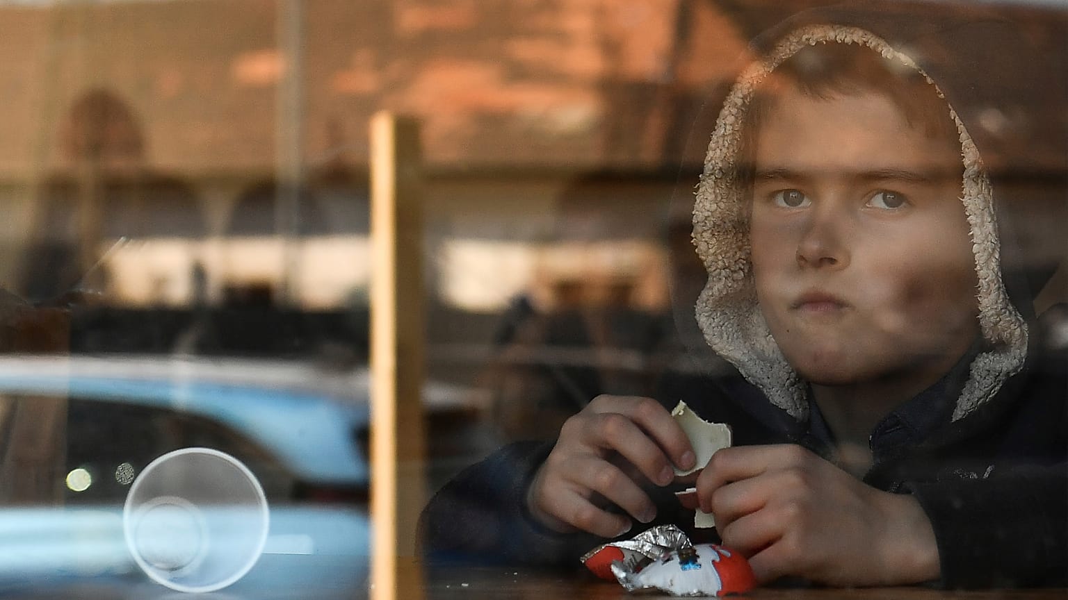 A young boy from Ukraine eats chocolate in a hostel in Budapest, Hungary, Thursday, March 24, 2022.