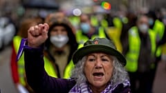 A woman shouts slogans during a protest of high energy prices in Madrid, Spain, Wednesday, March 23, 2022