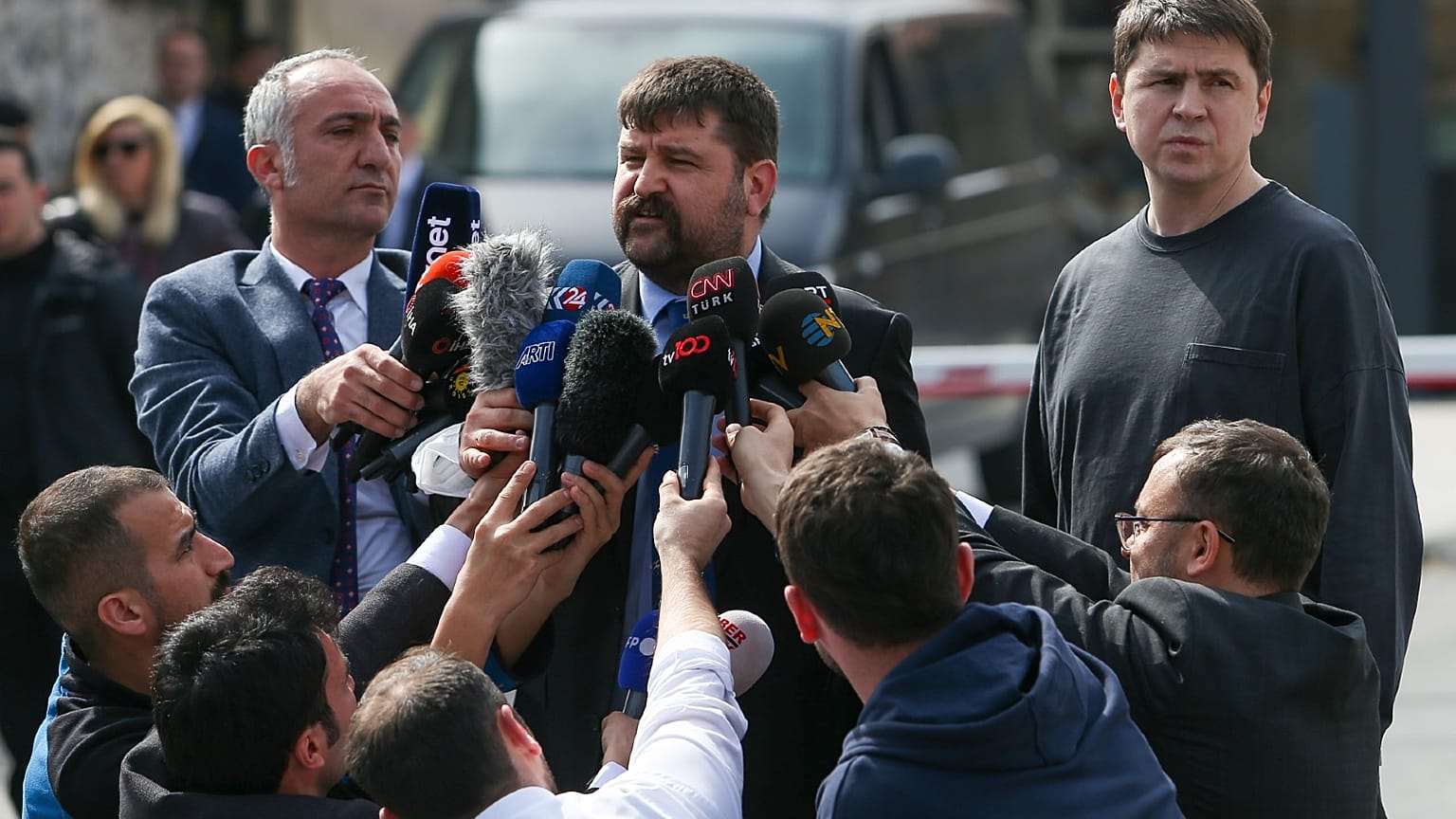 Mykhailo Podolyak, a member of the Ukrainian delegation, right, stands as a translator gives his statement after peace talks in Istanbul