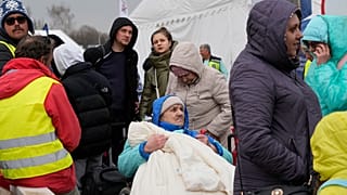 لاجئون أوكرانيون عند المعبر الحدودي في ميديكا، جنوب شرق بولندا، يوم الثلاثاء ، 29 مارس 2022
