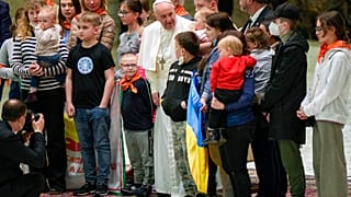 Pope Francis, center, poses for a photo with the Ukraine's Ambassador to the Holy See