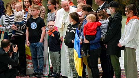 Pope Francis, center, poses for a photo with the Ukraine's Ambassador to the Holy See