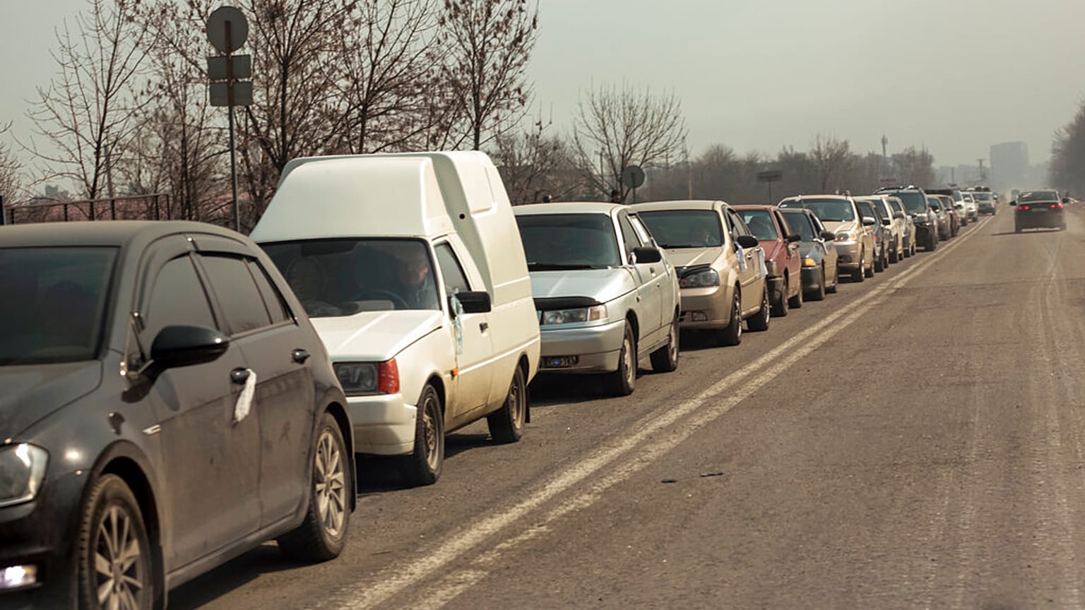 Local residents lineup in their cars to leave Mariupol, March 24, 2022.