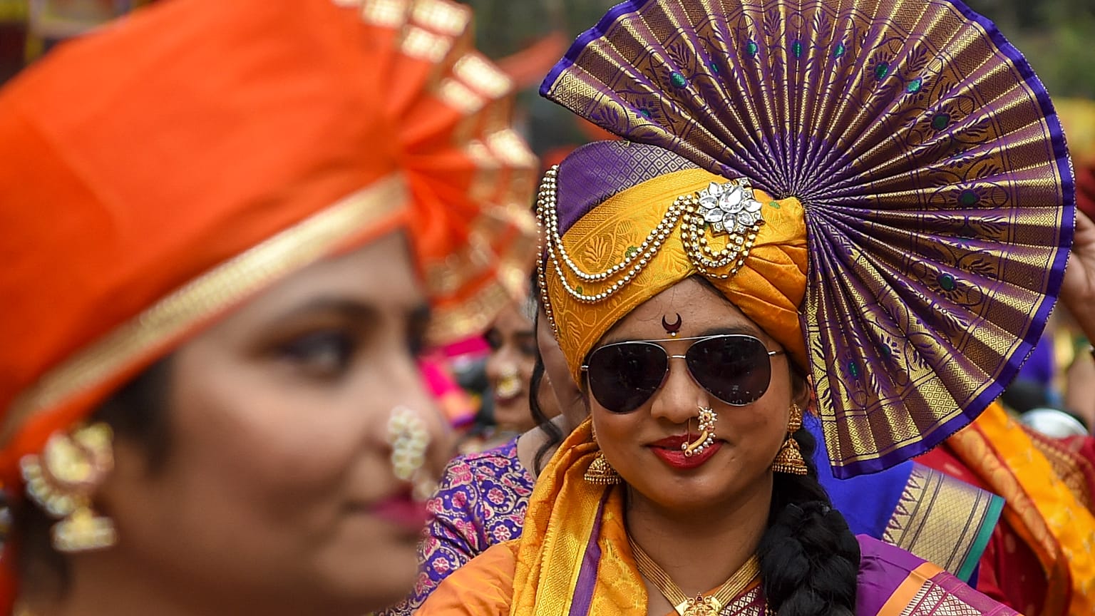 Women dressed in traditional attire take part in a procession celebrating 'Gudhi Padwa' or the Maharashtrian New Year, in Mumbai on April 2, 2022.