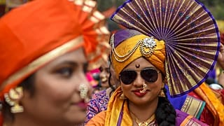Women dressed in traditional attire take part in a procession celebrating 'Gudhi Padwa' or the Maharashtrian New Year, in Mumbai on April 2, 2022.