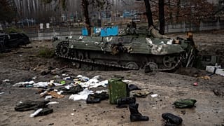 Military gear left by Russian soldiers are seen during a military sweep to search for possible remnants of Russian troops after their withdrawal from villages near Kyiv.