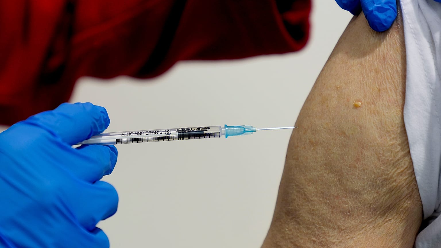 File photo shows a 87-year-old man getting his booster shot at the vaccination center in Frankfurt, Germany, Thursday, Nov. 11, 2021.
