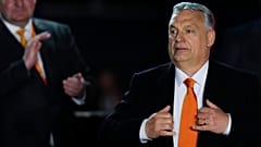 Hungary's Prime Minister Viktor Orban acknowledges cheering supporters during an election night rally in Budapest, Hungary, Sunday, April 3, 2022.