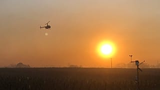 Caroline Schiel flies the Robinson helicopter over vine parcels in Burgundy at sunrise on Monday 4 April