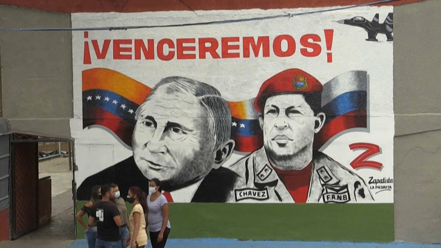 A smiling Vladimir Putin next to the deceased Hugo Chavez and a 'Z' for 'victory' are painted in a Caracas neighbourhood.