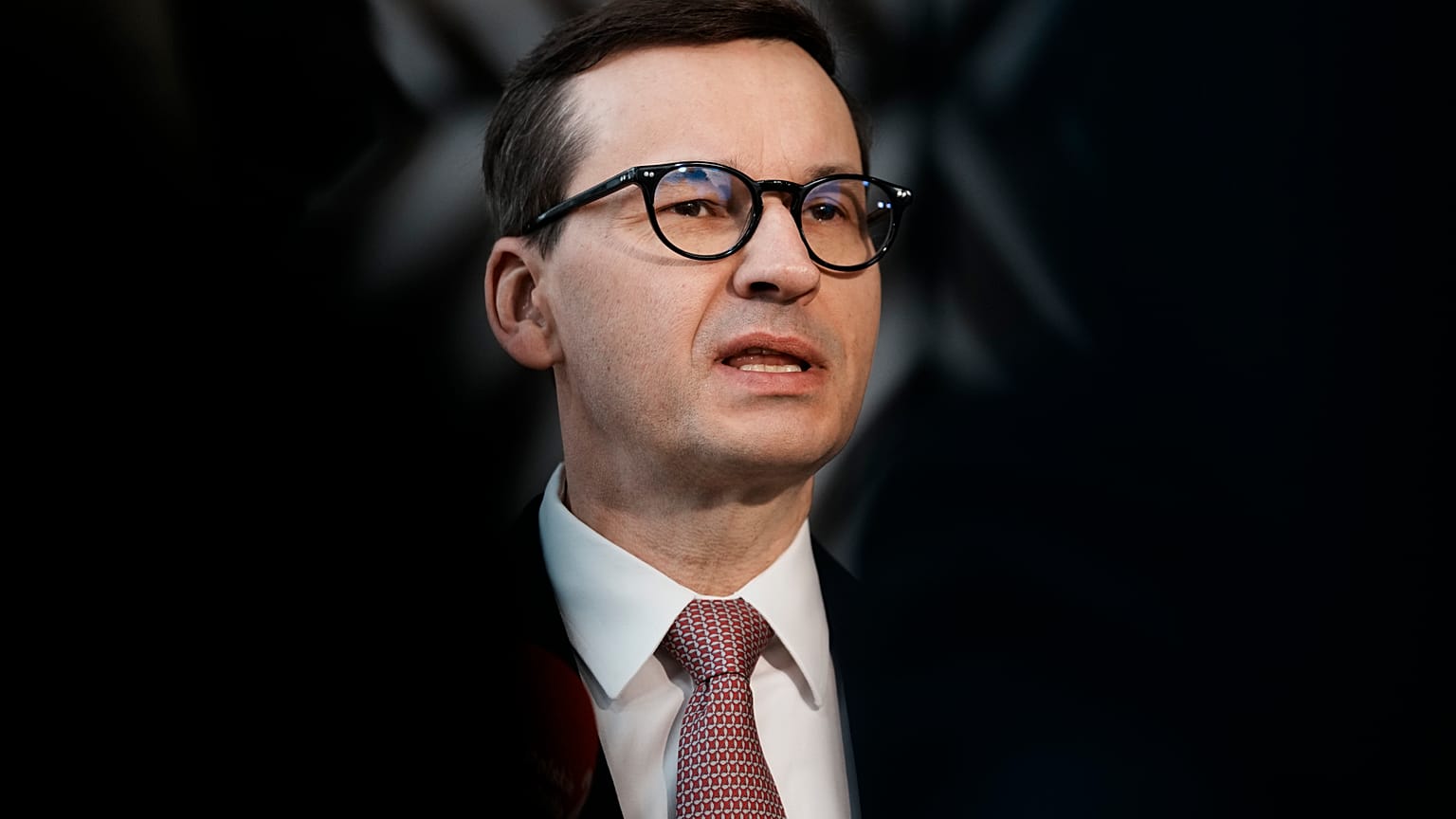 Poland's Prime Minister Mateusz Morawiecki speaks with the media as he arrives for an EU summit in March.