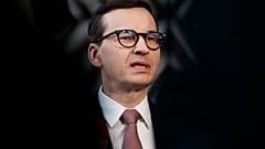 Poland's Prime Minister Mateusz Morawiecki speaks with the media as he arrives for an EU summit in March.