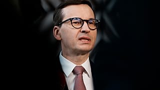 Poland's Prime Minister Mateusz Morawiecki speaks with the media as he arrives for an EU summit in March.