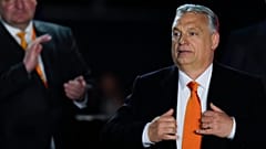 Hungary's Prime Minister Viktor Orban acknowledges cheering supporters during an election night rally in Budapest, Hungary, April 3, 2022. 