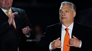 Hungary's Prime Minister Viktor Orban acknowledges cheering supporters during an election night rally in Budapest, Hungary, April 3, 2022. 