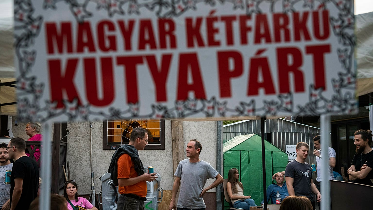 Gergely Kovacs, center, leader of the Hungarian satiricial Ketfarku Kutya (Two-tailed Dog Party) at the party's headquarters after the European Parliament elections in Budapes