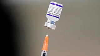 A syringe is prepared with the Pfizer COVID-19 vaccine at a vaccination clinic at the Keystone First Wellness Center in Chester, Pa., on December 15, 2021. 