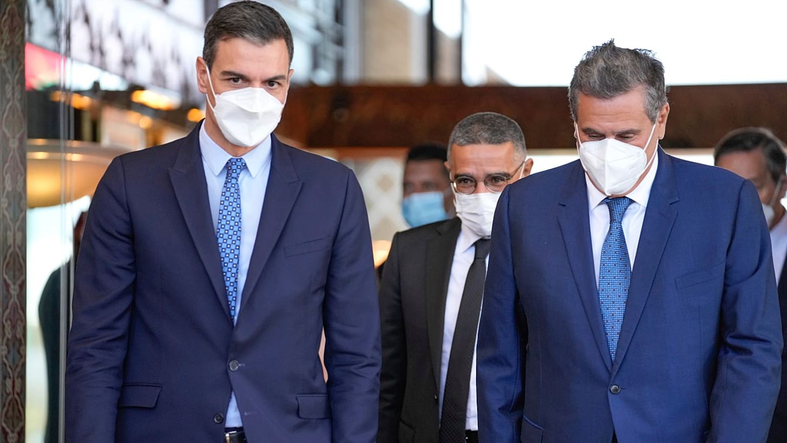 Spanish Prime Minister Pedro Sanchez (L) is welcomed by Morocco's Prime Minister Aziz Akhannouch as he arrives in Rabat.