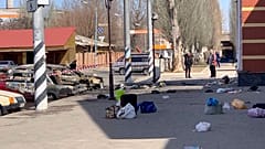 personal belongings of victims and burnt-out vehicles after a rocket attack on the railway station in the eastern city of Kramatorsk, in the Donbass region on April 8, 2022. 