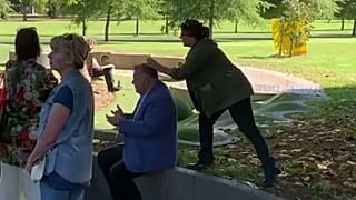 "Stop hanging out with Nazis," the woman claimed, before smashing the egg on Craig Kelly's head