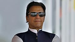 FILE - Pakistan's Prime Minister Imran Khan attends a military parade to mark Pakistan National Day, in Islamabad, Pakistan on March 23, 2022.