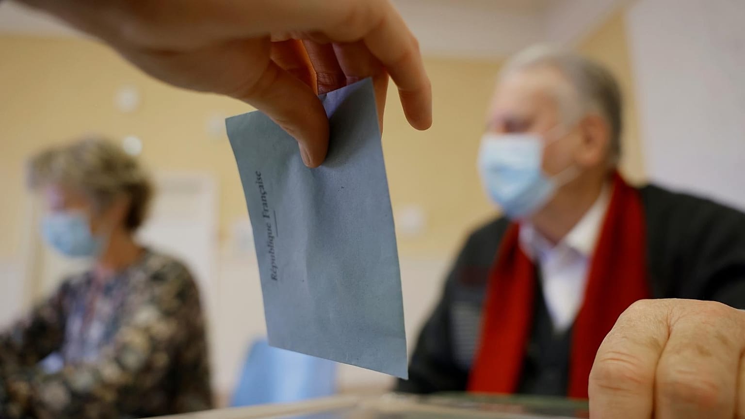 A woman casts her vote in the first round of the French presidential election, in Selestat, eastern France Sunday, 10 April, 2022.