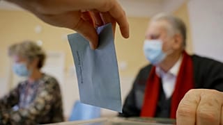 A woman casts her vote in the first round of the French presidential election, in Selestat, eastern France Sunday, 10 April, 2022.