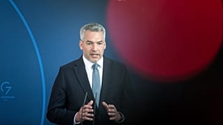 Austria's Chancellor Karl Nehammer attends a news conference with German Chancellor Olaf Scholz after a meeting at the chancellery in Berlin, Germany, Thursday, March 31, 2022