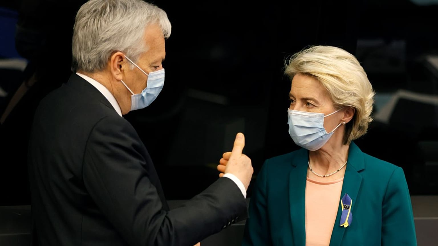 European Commissioner for Justice Didier Reynders (L) speaks with European Commission President Ursula von der Leyen.