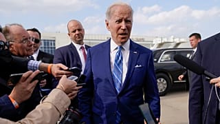 President Joe Biden speaks to reporters before boarding Air Force One at Des Moines International Airport in Iowa on 12 April, 2022