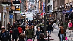 People visit one of Stockholm's busiest shopping streets on February 4, 2022.