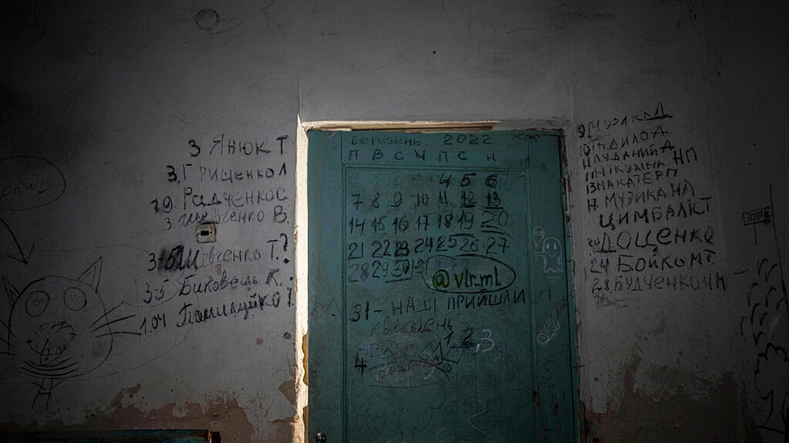 The names of the dead were scrawled on the basement's entrance