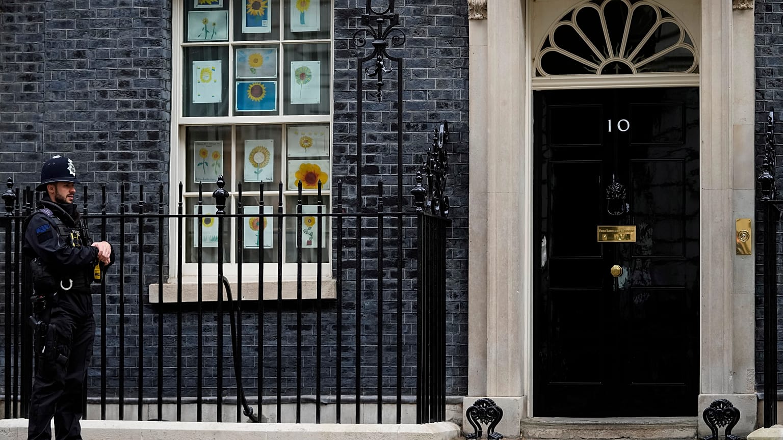 A police officer guards the entrance to 10 Downing Street in London.
