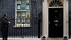 A police officer guards the entrance to 10 Downing Street in London.