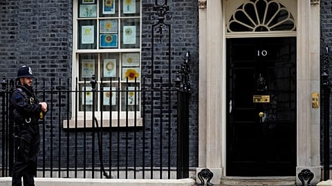 A police officer guards the entrance to 10 Downing Street in London.