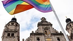 A rainbow flag flies over the New City Hall in Leipzig.