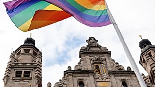 A rainbow flag flies over the New City Hall in Leipzig.