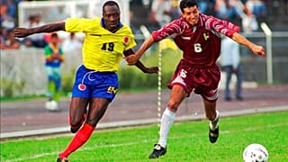 Colombian player Freddy Rincon, left, fights for the ball with Elvis Martinez of Venezuela during a qualifying France '98 game in San Cristobal, Venezuela