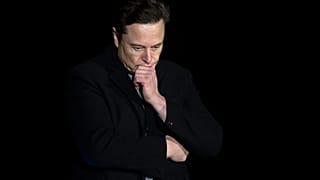 Elon Musk gestures as he speaks during a press conference at SpaceX's Starbase facility near Boca Chica Village in South Texas, 2022