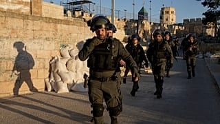 Israeli security forces gather during clashes with Palestinian demonstrators at the Al Aqsa Mosque compound in Jerusalem's Old City